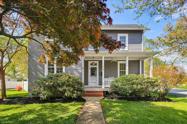 a view of an entryway with wooden floor and door