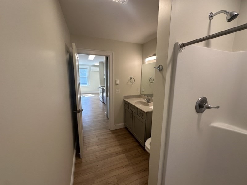 462 Main Street, Unit 3 Amherst, MA 01002 - Photo 11 of 13 a bathroom with a sink and mirror