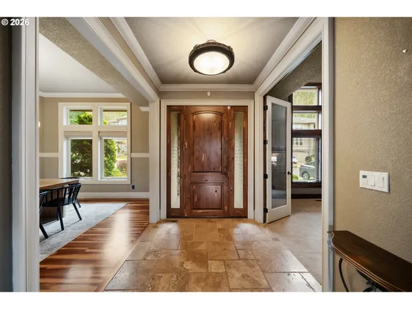 hallway with wooden floor and windows