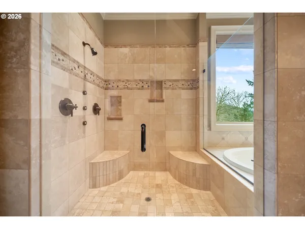 a bathroom with a bathtub and a shower