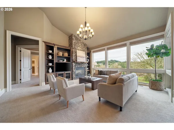 a living room with furniture and a large window