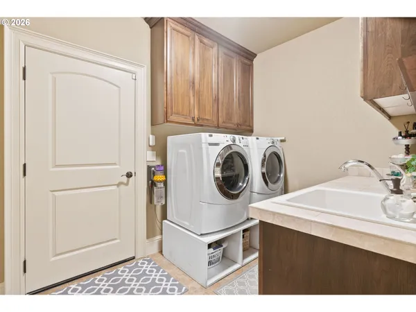 a utility room with dryer and washer