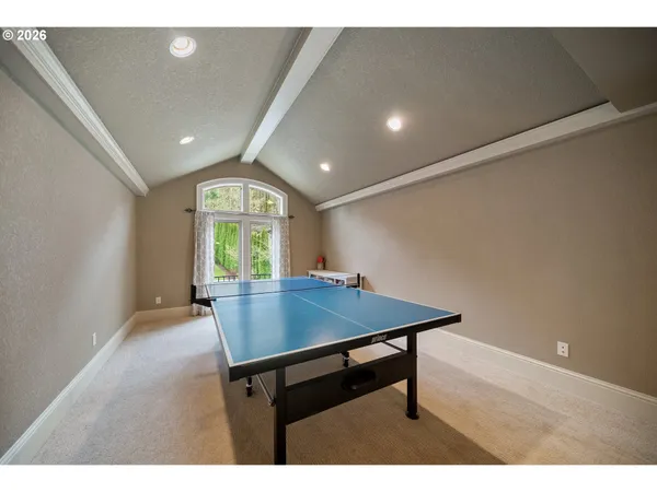 a view of a room with furniture and window