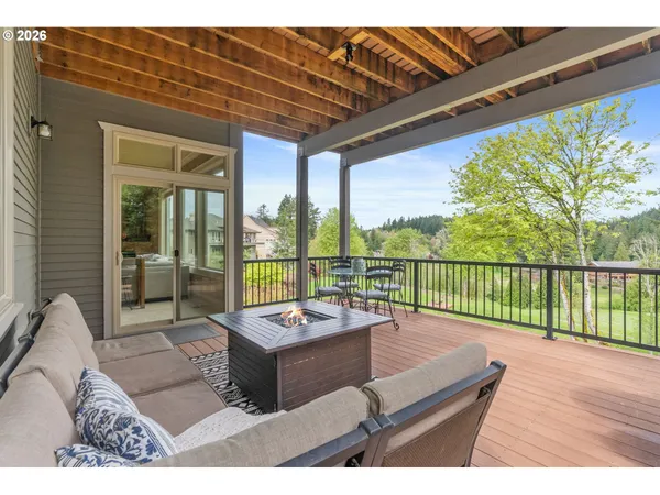 a view of a deck with couches with wooden floor and fence