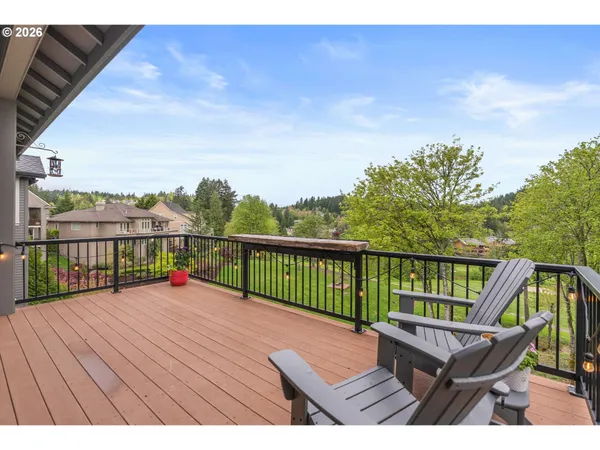 a view of balcony with wooden floor and outdoor seating