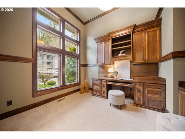 a kitchen with a sink cabinets and appliances
