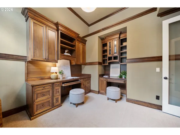 a kitchen with a refrigerator and cabinets