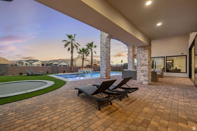 4871 South Homestead Way Washington, UT 84780 - Photo 110 of 151 Patio terrace at dusk with a patio and a fenced backyard