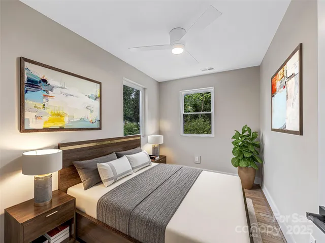 a bedroom with bed and window