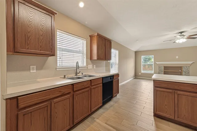 a kitchen with a sink and cabinets