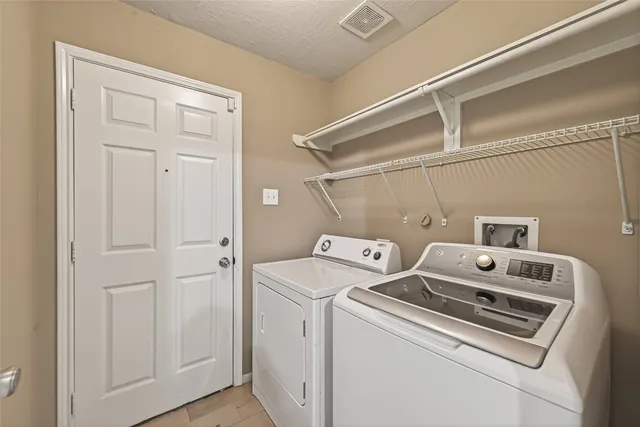 a bathroom with a sink toilet vanity and shower