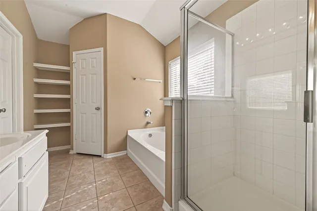 a bathroom with double sink and a mirror