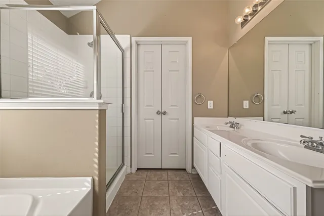 a bathroom with a tub sink and a shower