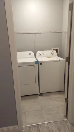 a utility room with dryer and washer