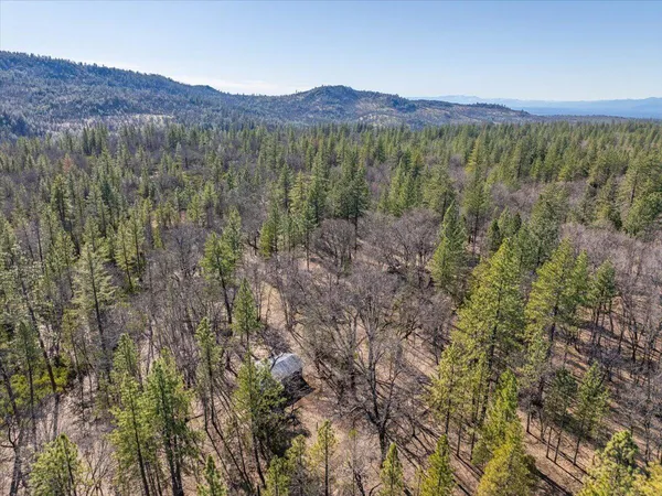 a view of a road with a building in the background