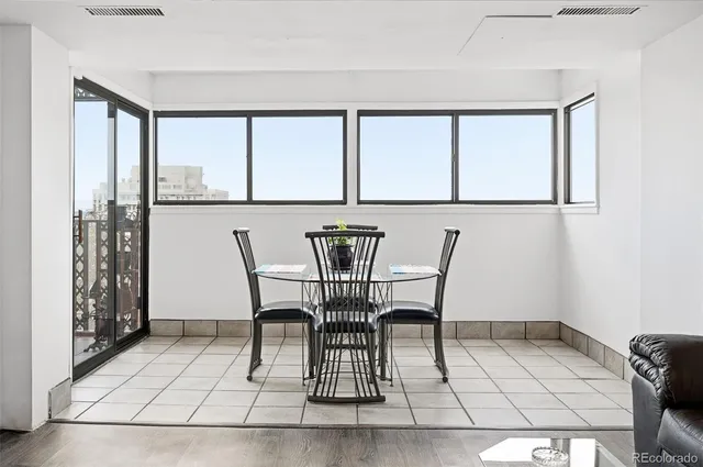 a view of a dining room with furniture and window