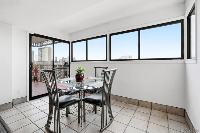 a view of a dining room with furniture window and outside view