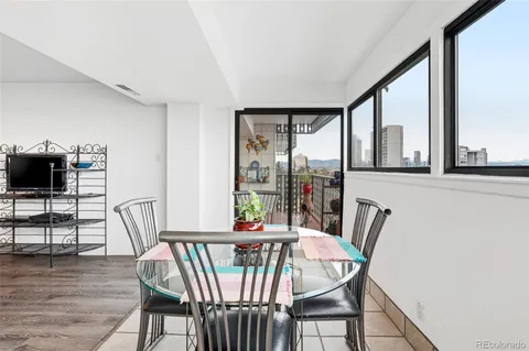 a view of a dining room with furniture window and wooden floor