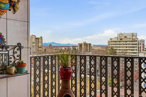 a view of a balcony with city view
