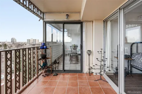 a view of a balcony with wooden floor