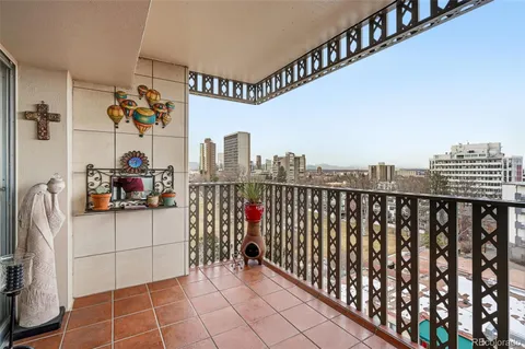 a view of a balcony with an outdoor seating