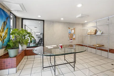 a kitchen with a table and chairs in it