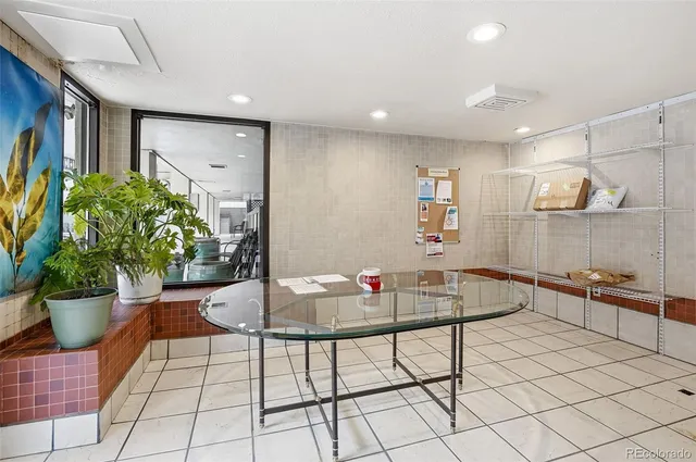 a kitchen with a table and chairs in it