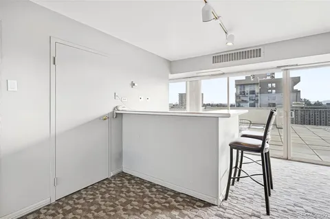 a view of a kitchen from the hallway