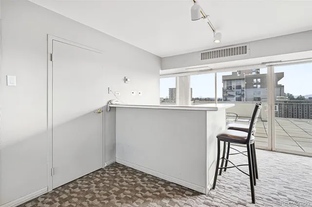 a view of a kitchen from the hallway
