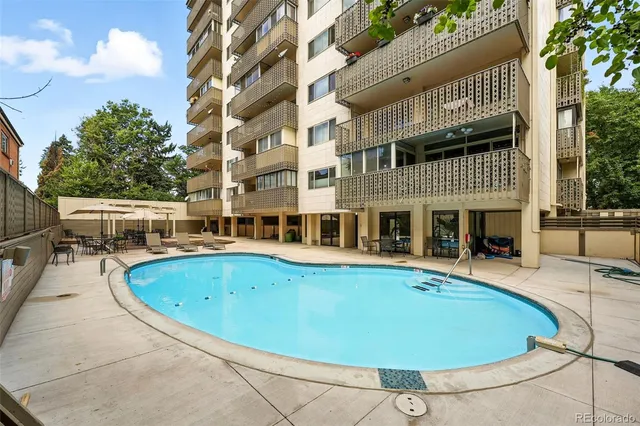 a view of a swimming pool with a patio