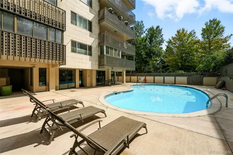 a view of a swimming pool with a lounge chairs