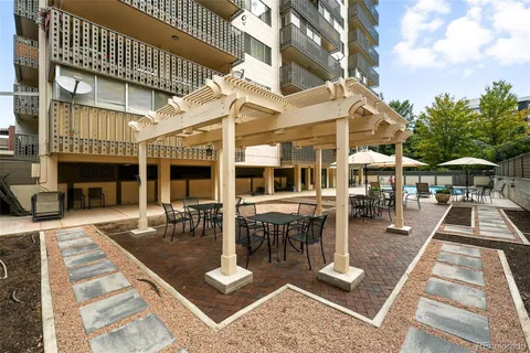 a view of a building with sitting area