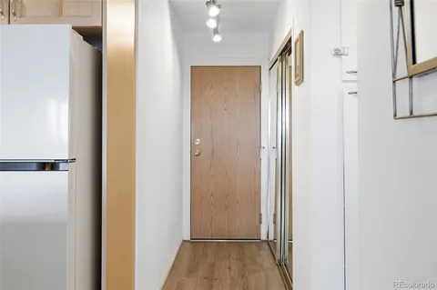 a view of hallway with wooden floor