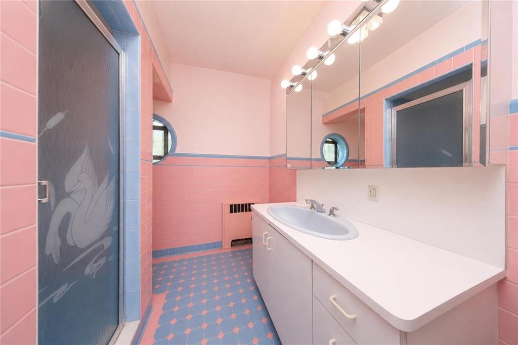 1 Bay Ridge Parkway Brooklyn, NY 11209 - Photo 23 of 38 a bathroom with a sink a vanity and a mirror