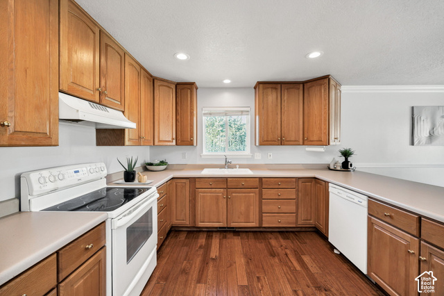 1143 East Mountain Road Logan, UT 84321 - Photo 5 of 64 Wood-finish flooring, recessed lighting, wood cabinetry, built-in dishwasher, and a white oven range