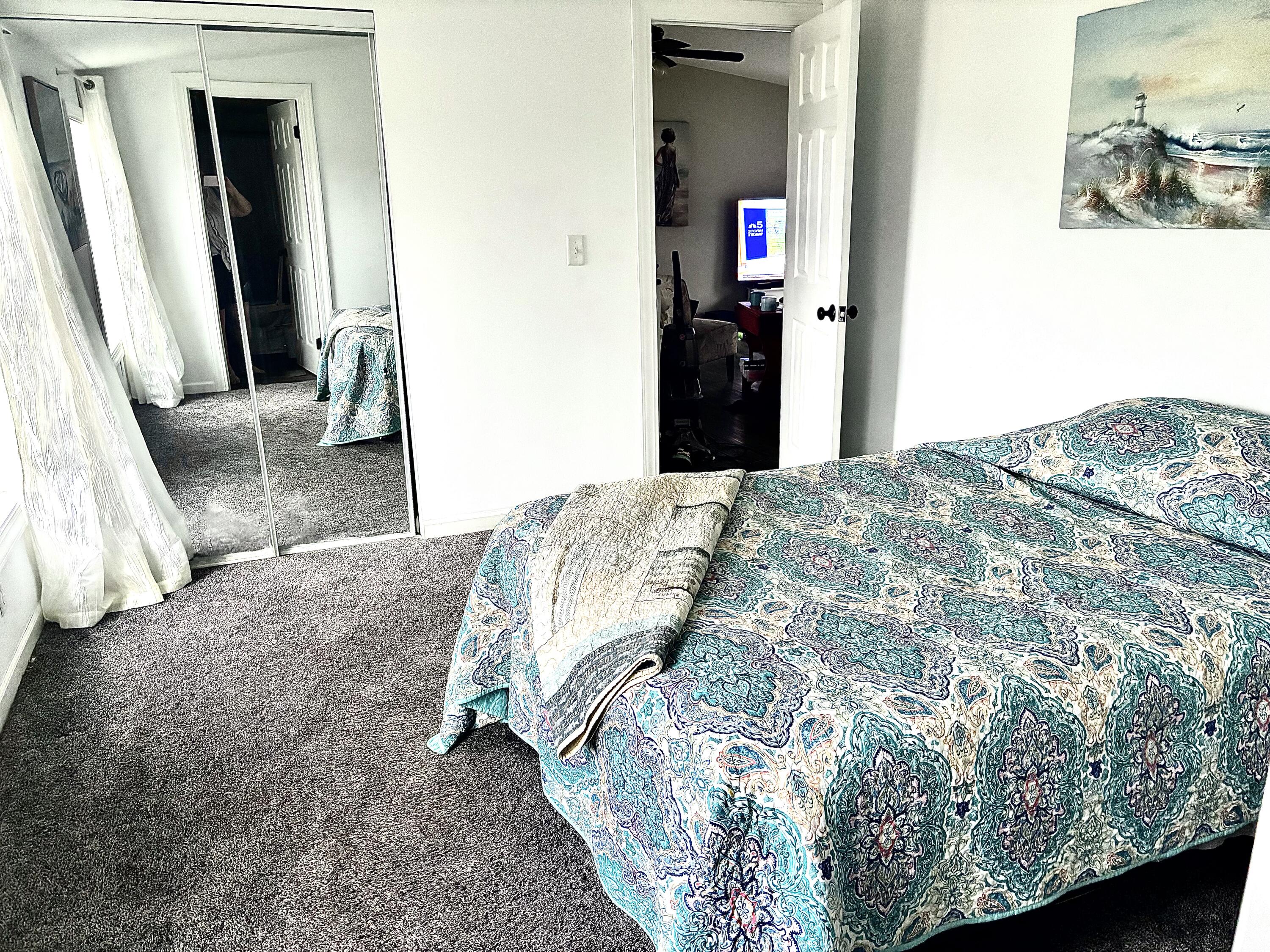 15806 Clark Street Lowell, IN 46356 - Photo 12 of 35 a bedroom with a bed and a mirror