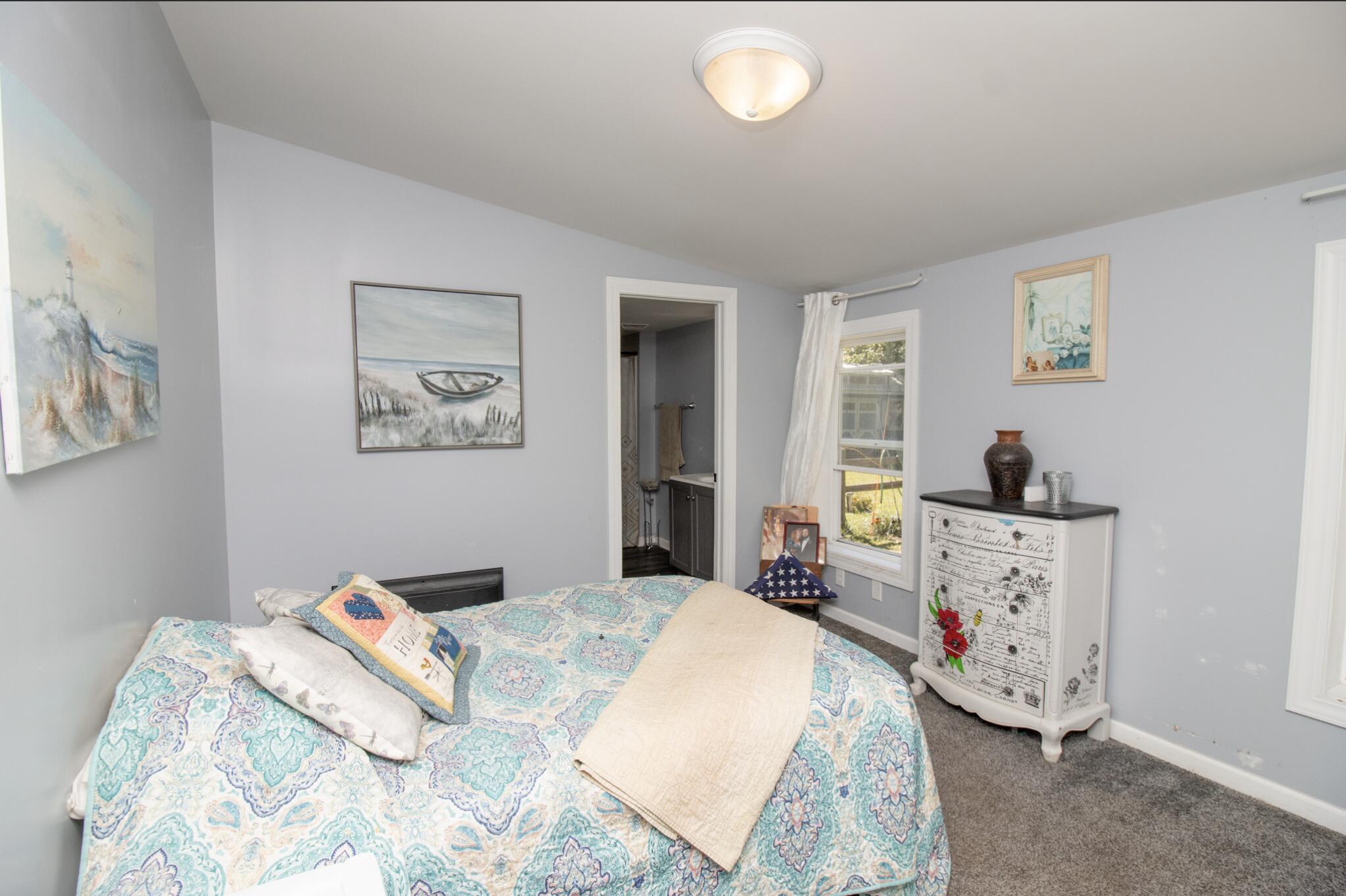 15806 Clark Street Lowell, IN 46356 - Photo 13 of 35 a bedroom with bed and window