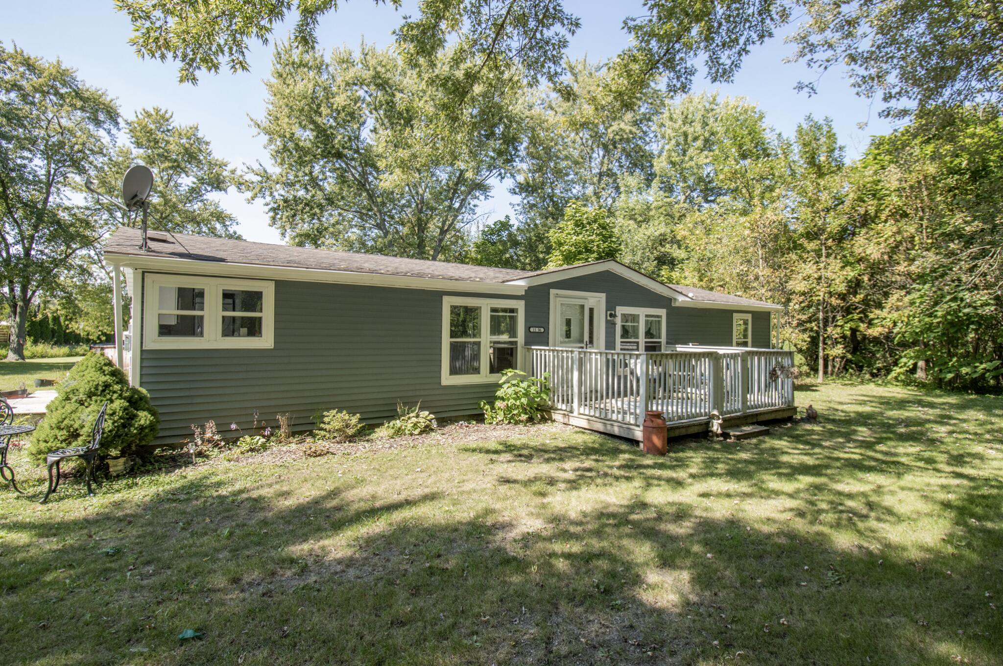 15806 Clark Street Lowell, IN 46356 - Photo 2 of 35 a front view of house with yard and trees in the background