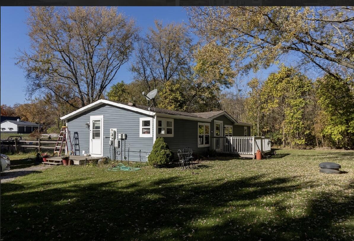 15806 Clark Street Lowell, IN 46356 - Photo 30 of 35 a front view of house with yard and green space