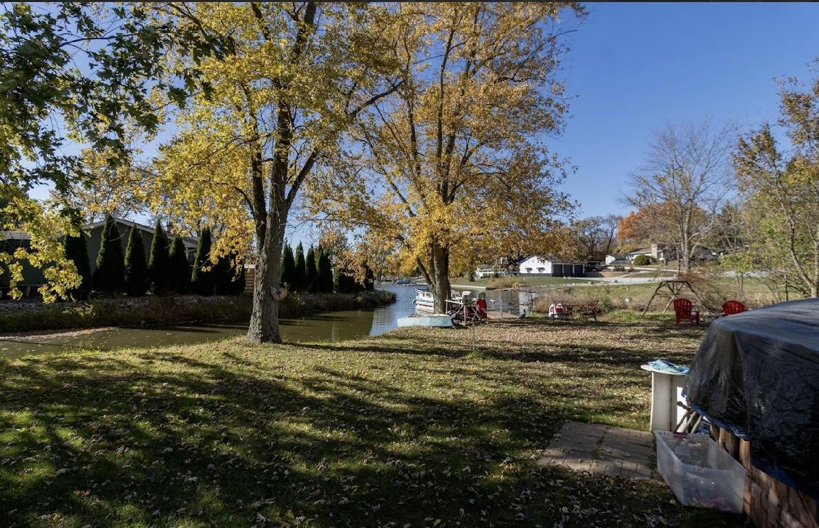 15806 Clark Street Lowell, IN 46356 - Photo 33 of 35 a view of a yard with a tree