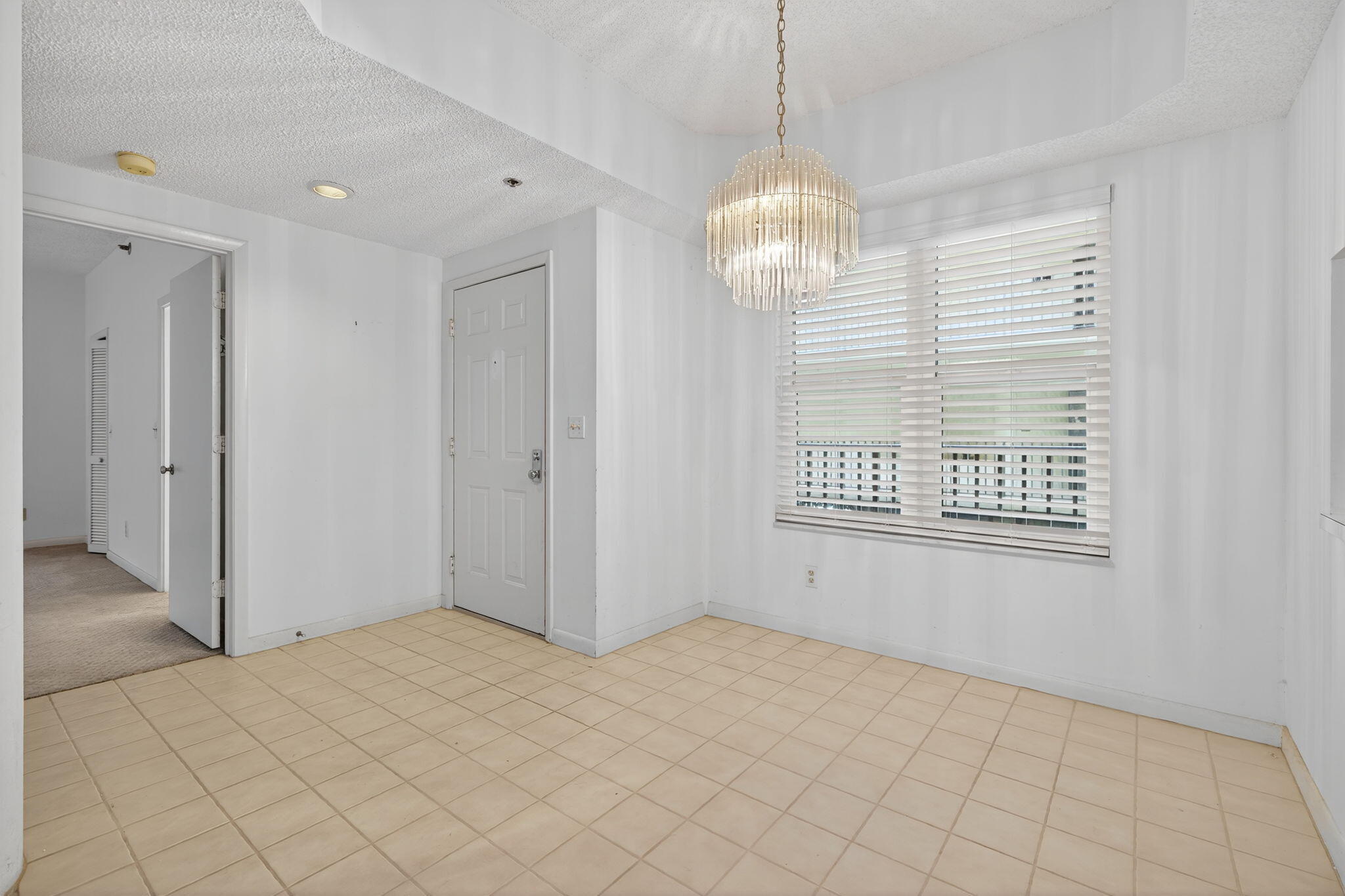 221 Northeast Plantation Road, Unit 213 Stuart, FL 34996 - Photo 14 of 44 a view of an empty room with a window