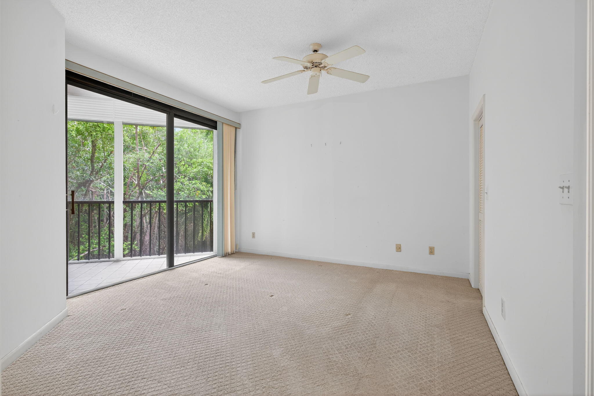 221 Northeast Plantation Road, Unit 213 Stuart, FL 34996 - Photo 17 of 44 a view of an empty room with a window