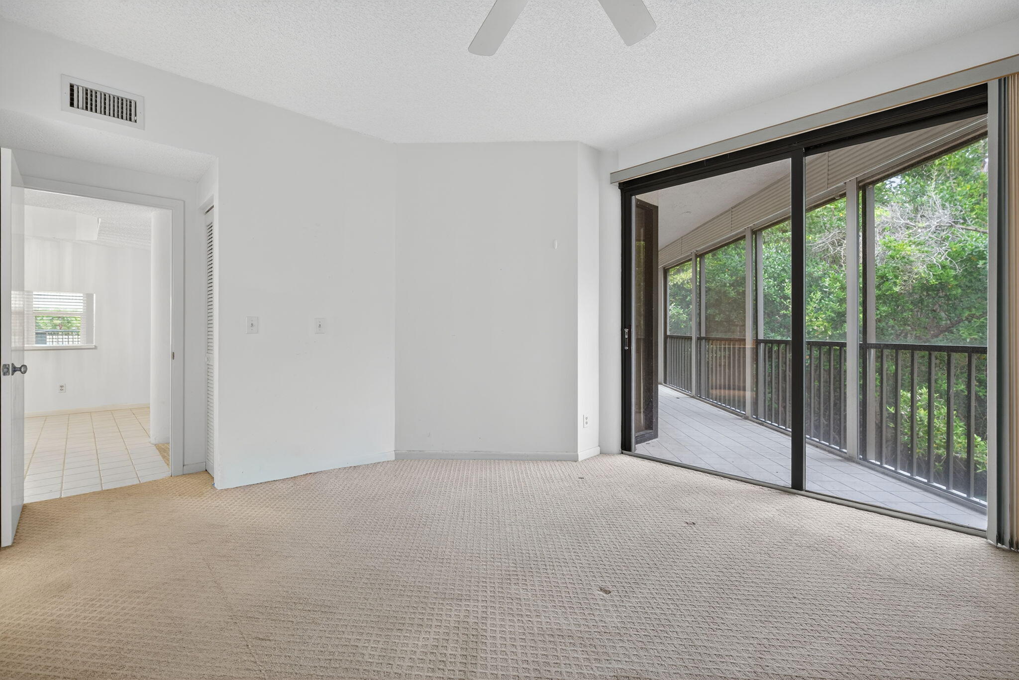 221 Northeast Plantation Road, Unit 213 Stuart, FL 34996 - Photo 21 of 44 a view of empty room with sliding door and balcony