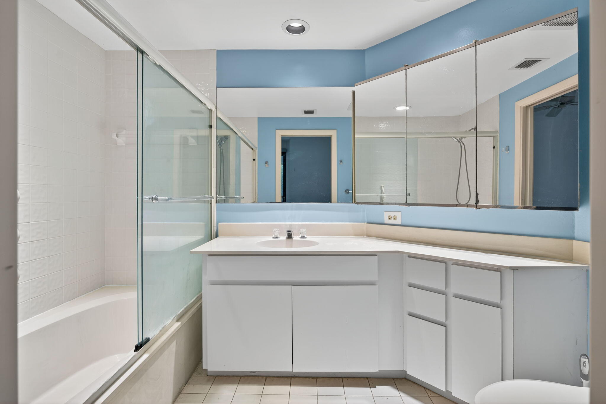 221 Northeast Plantation Road, Unit 213 Stuart, FL 34996 - Photo 22 of 44 a bathroom with a sink and a mirror