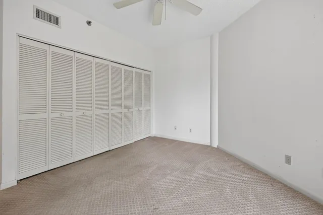 a kitchen with granite countertop a stove sink and cabinets