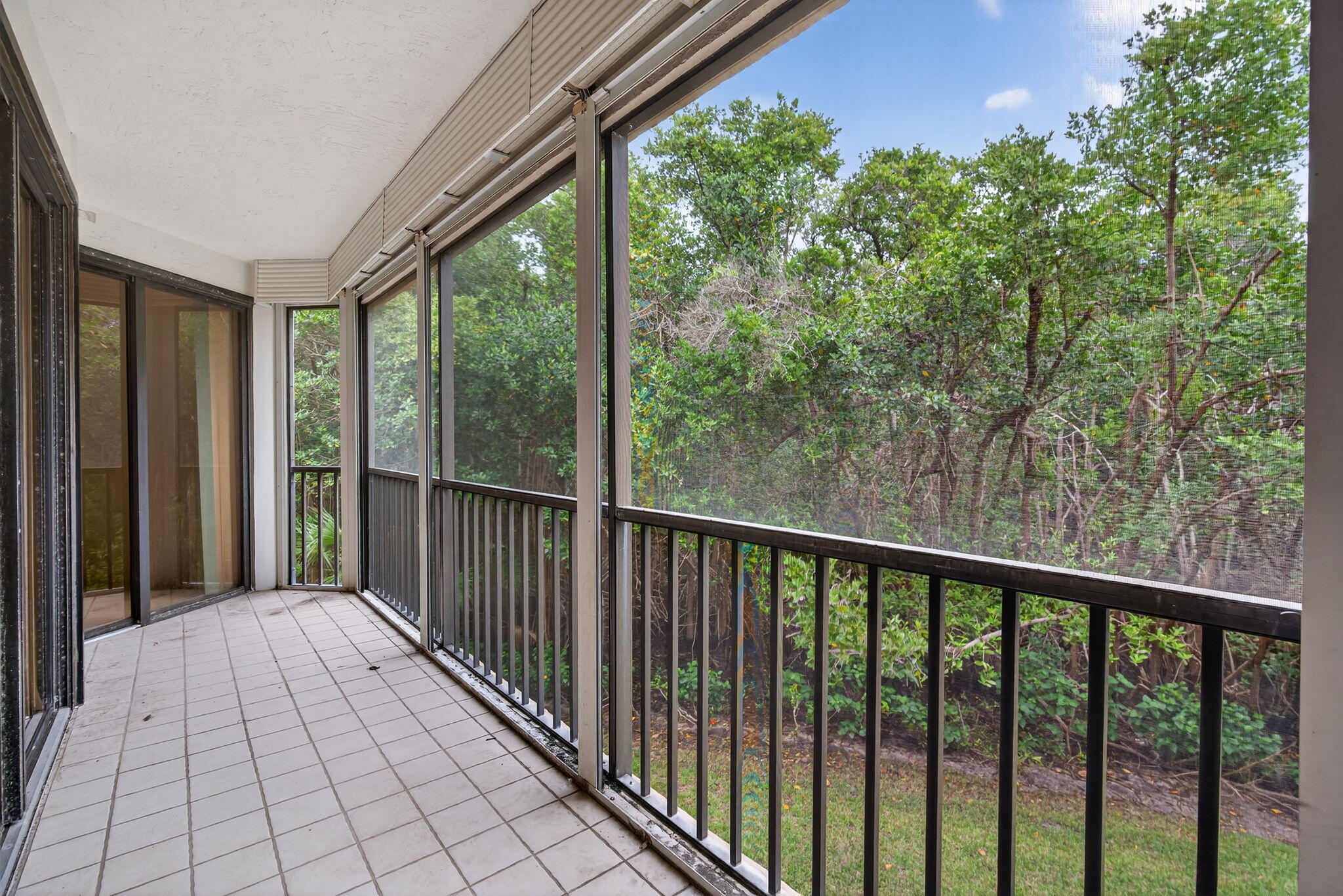 221 Northeast Plantation Road, Unit 213 Stuart, FL 34996 - Photo 38 of 44 a view of a balcony with wooden floor