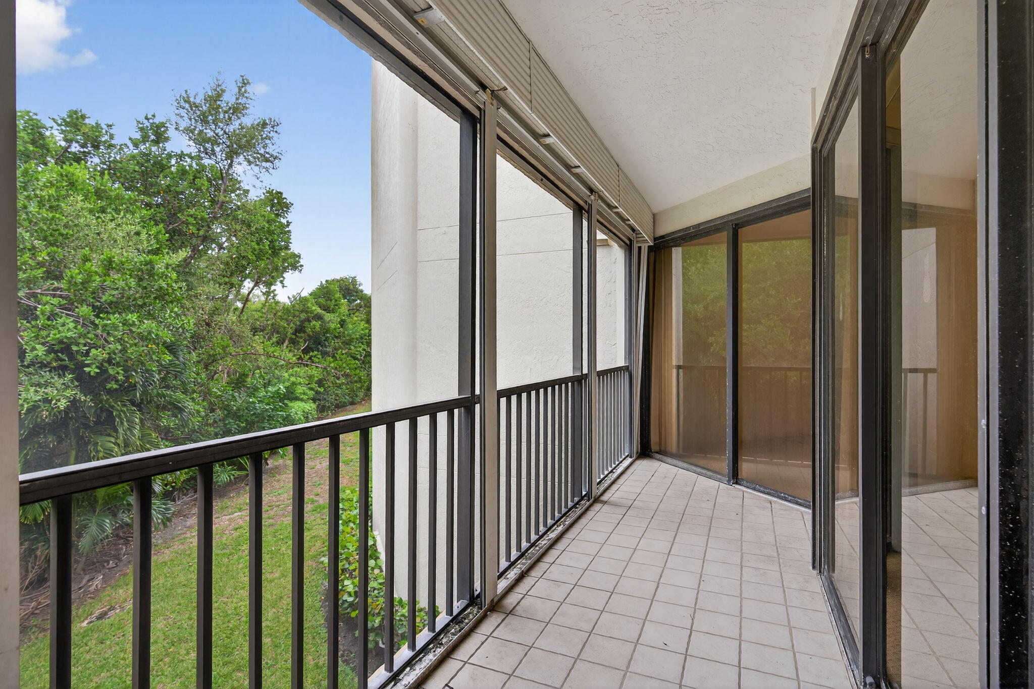 221 Northeast Plantation Road, Unit 213 Stuart, FL 34996 - Photo 39 of 44 a view of a balcony with wooden floor