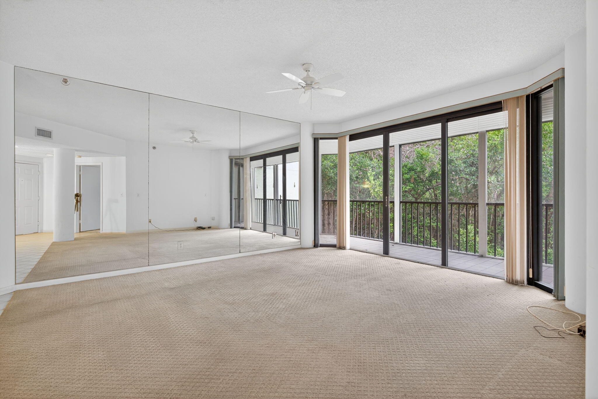 221 Northeast Plantation Road, Unit 213 Stuart, FL 34996 - Photo 7 of 44 a view of an empty room with a balcony