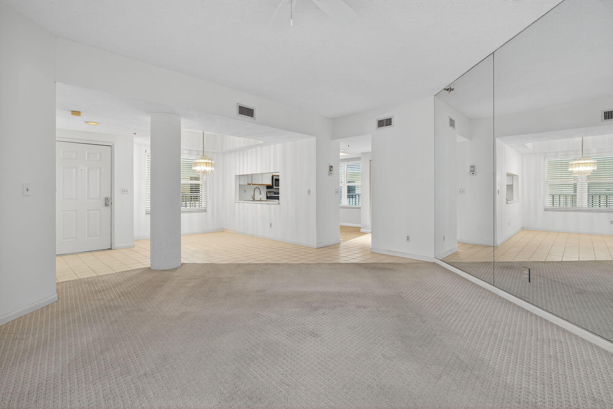 221 Northeast Plantation Road, Unit 213 Stuart, FL 34996 - Photo 10 of 44 a view of a livingroom with wooden floor and a bathroom
