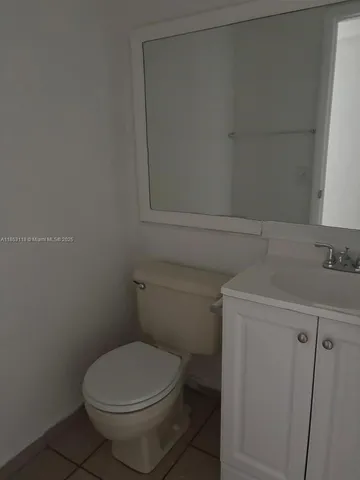 a bathroom with a toilet and a sink